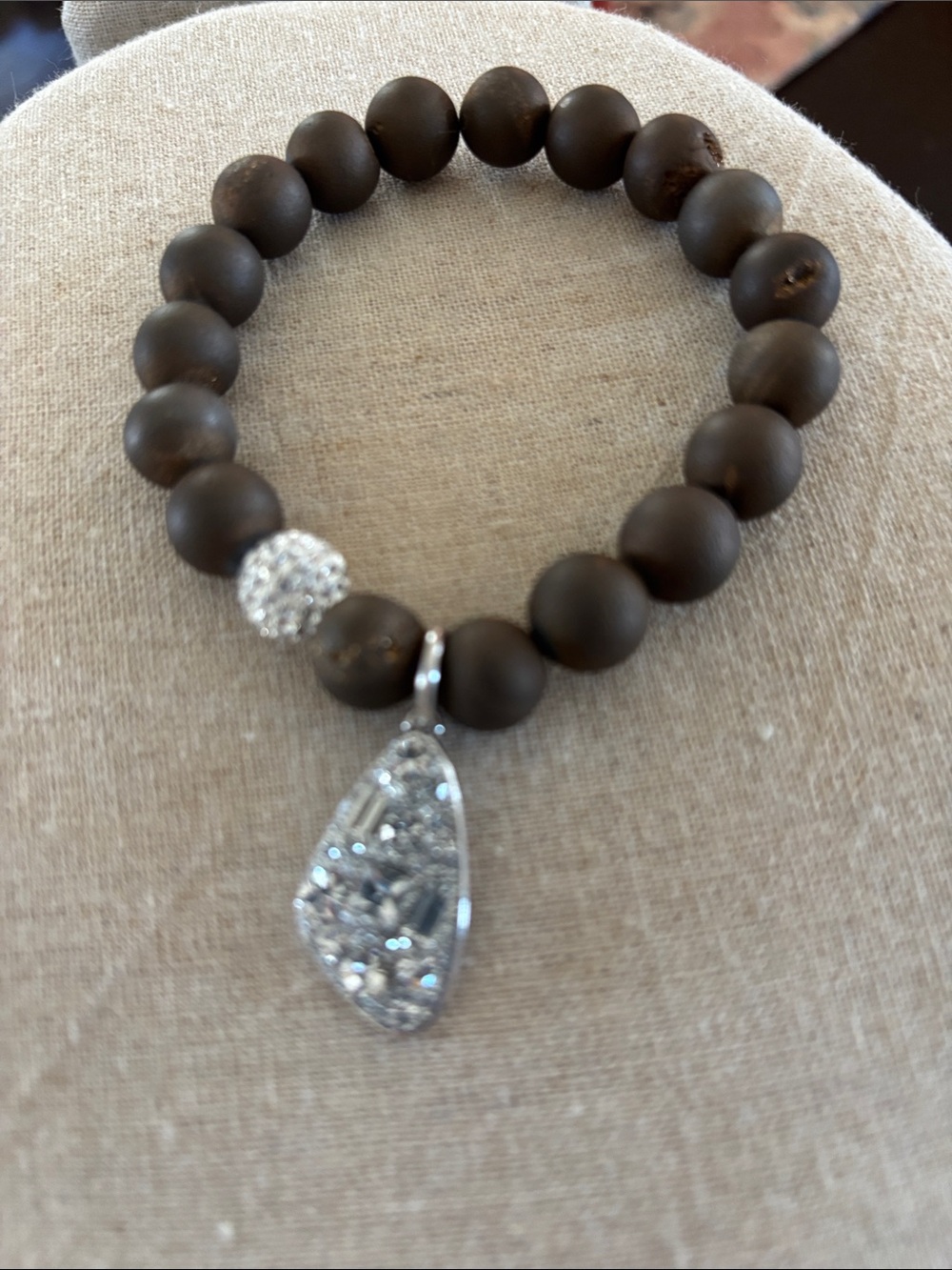 FAC Stamped beaded with rhinestone ball and charm on it.